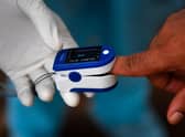 Pulse oximeters are currently being rolled out by the NHS to some Covid-19 patients across the UK (Getty Images)