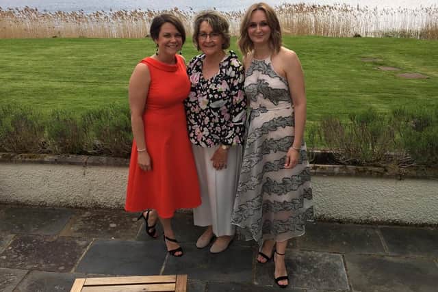 Catherine Symington, middle, pictured with her two daughters.