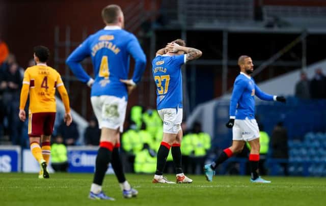 Rangers midfielder Scott Arfield holds his head in despair at full-time after the Scottish champions dropped two points in a 2-2 draw against Motherwell at Ibrox. (Photo by Craig Williamson / SNS Group)