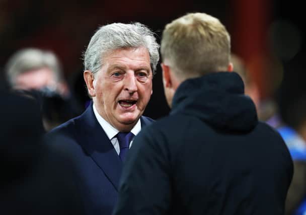 Roy Hodgson, manager of Crystal Palace shakes hands with then-Bournemouth boss Eddie Howe in 2018