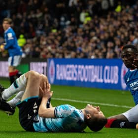 Dundee's Ryan Sweeney reacts after a clash with Rangers winger Fashion Sakala during the Premier Sports Cup quarter-final at Ibrox.  (Photo by Paul Devlin / SNS Group)