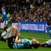 Dundee's Ryan Sweeney reacts after a clash with Rangers winger Fashion Sakala during the Premier Sports Cup quarter-final at Ibrox.  (Photo by Paul Devlin / SNS Group)