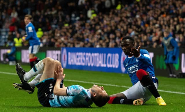 Dundee's Ryan Sweeney reacts after a clash with Rangers winger Fashion Sakala during the Premier Sports Cup quarter-final at Ibrox. (Photo by Paul Devlin / SNS Group)
