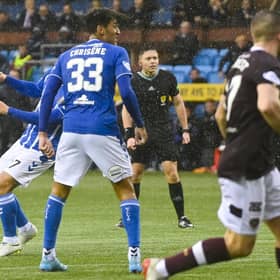 Nathaniel Atkinson scored in stoppage time to earn Hearts a point at Rugby Park.