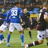 Nathaniel Atkinson scored in stoppage time to earn Hearts a point at Rugby Park.