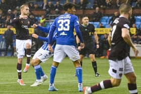 Nathaniel Atkinson scored in stoppage time to earn Hearts a point at Rugby Park.