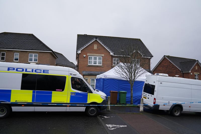 Several police vehicles are parked outside the Glasgow home of Peter Murrell and Nicola Sturgeon, and a blue police tent has been put up in the front garden.