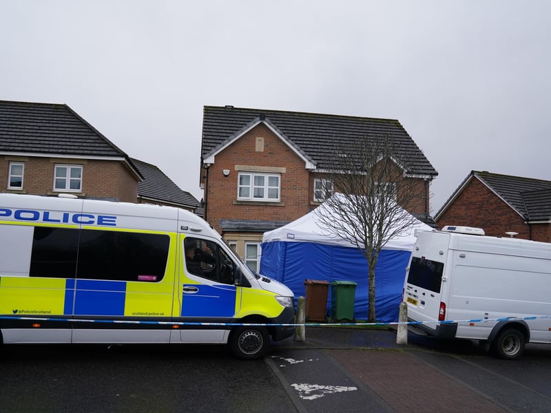 Several police vehicles are parked outside the Glasgow home of Peter Murrell and Nicola Sturgeon, and a blue police tent has been put up in the front garden.