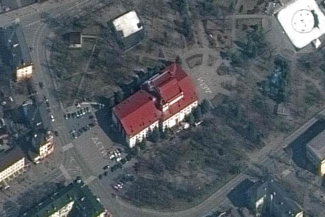 A satellite image shows the Mariupol Drama Theatre, a designated shelter for children and elderly people, with the Russian word for children written in large white letters in front of and behind the building, before it was hit by Russian missiles (Picture: satellite image ©2022 Maxar Tech/AFP via Getty Images)