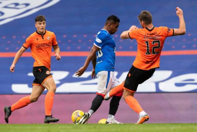 Dundee United's Ryan Edwards catches Rangers' Alfredo Morelos during a Scottish Premiership match at Ibrox (Photo by Alan Harvey / SNS Group)