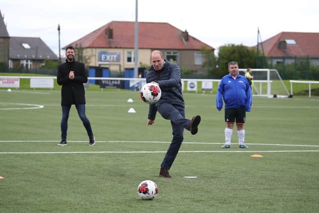 The Duke of Cambridge on the pitch during a visit to Spartans FC's Ainslie Park Stadium in Edinburgh to hear about initiatives in Scottish football that champion mental health ahead of the Scottish Cup Final on Saturday picture: PA