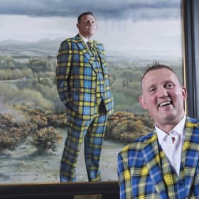Doddie Weir with his painting in the Scottish National Portrait Gallery (SNPG)