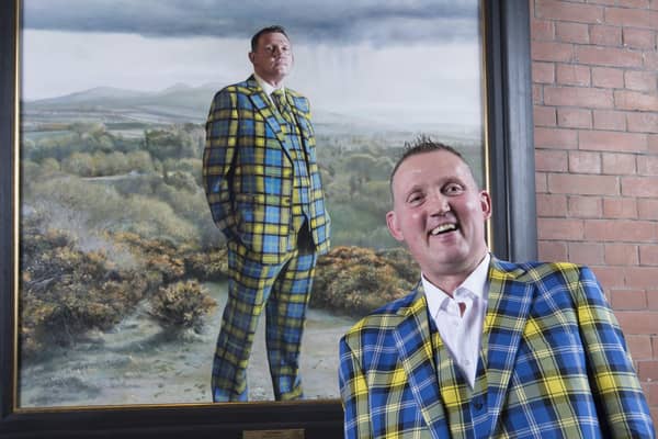 Doddie Weir with his painting in the Scottish National Portrait Gallery (SNPG)