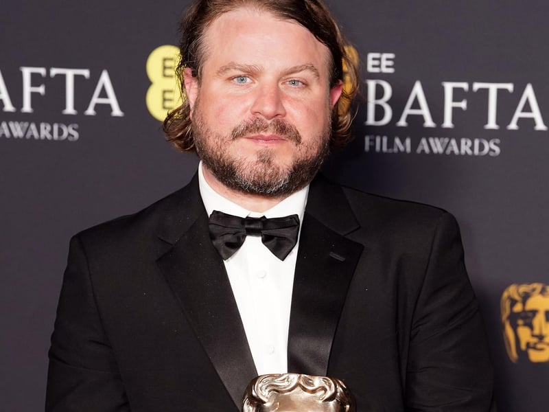 Brady Corbet in the press room after winning the Best Director award for The Brutalist during the 78th British Academy Film Awards