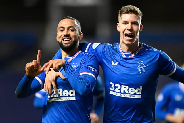 Kemar Roofe celebrates with Cedric Itten after scoring to make it 3-1 to Rangers. Picture: SNS