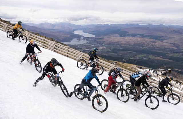 Cyclists descend over 900m from the summit of Aonach Mor in the Nevis Range near Fort William. Picture: Jane Barlow/PA Wire