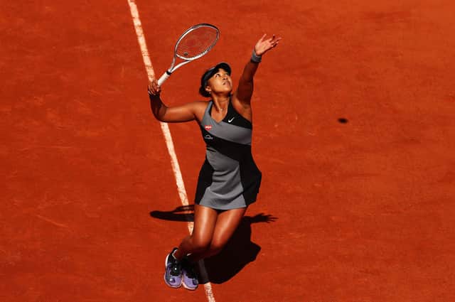 Naomi Osaka serves to Patricia Maria Tig of Romania during her first-round victory at the French Open at Roland Garros. Picture: Julian Finney/Getty Images