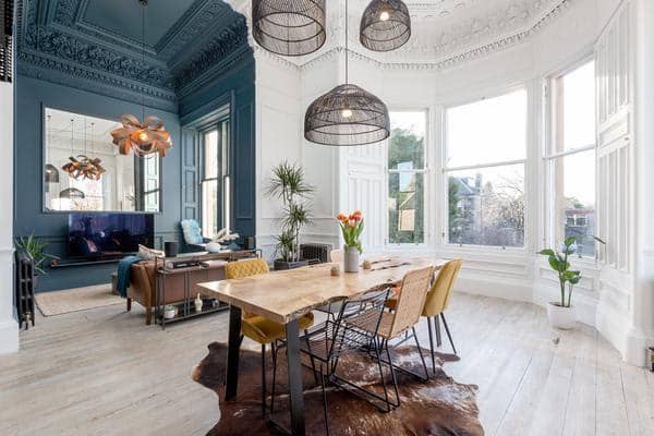 Vintage colours and bold paint designs open up the room