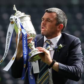 St Johnstone manager Callum Davidson celebrates with the Scottish Cup trophy after the final whistle during the Scottish Cup final match at Hampden Park, Glasgow.