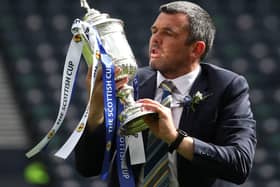 St Johnstone manager Callum Davidson celebrates with the Scottish Cup trophy after the final whistle during the Scottish Cup final match at Hampden Park, Glasgow.