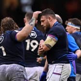 Rory Sutherland leaves the field in some discomfort during Scotland's Six Nations clash with Wales.