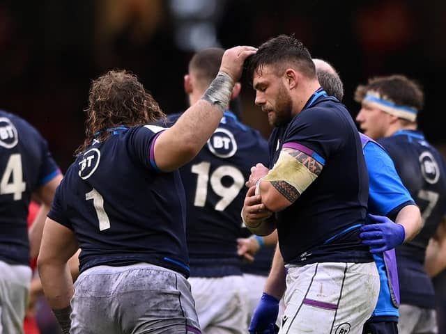 Rory Sutherland leaves the field in some discomfort during Scotland's Six Nations clash with Wales.