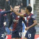 Mikey Johnston, left, celebrates with team-mates after helping West Brom win 4-1 away at Huddersfield.