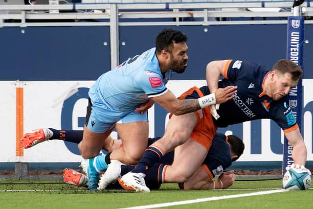 Mark Bennett goes over in the corner to score Edinburgh's third try against Cardiff. (Photo by Ross Parker / SNS Group)