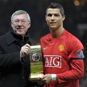 Cristiano Ronaldo poses with his Fifa world player of the year trophy in 2009 alongside the then Manchester United manager Alex Ferguson (Picture: Andrew Yates/AFP via Getty Images)