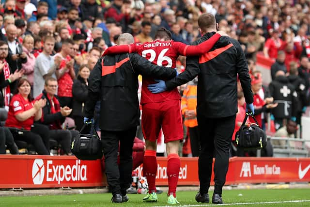 Andy Robertson has to be helped from the pitch by Liverpool medical staff after suffering an ankle injury during a friendly against Athletic Bilbao.