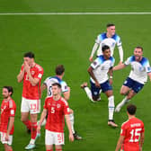 Marcus Rashford of England celebrates with teammates after opening the scoring against Wales.