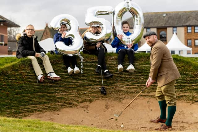 Musselburgh Old Course Golf Club member James Bonthron is joined in commemorating the 350th anniversary of the town's Old Course by youngsters Brodie Irving, Ellie Robertson, Neena Irving and Freya Robertson. Picture: Alan Rennie