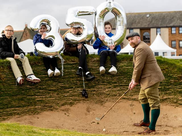 Musselburgh Old Course Golf Club member James Bonthron is joined in commemorating the 350th anniversary of the town's Old Course by youngsters Brodie Irving, Ellie Robertson, Neena Irving and Freya Robertson. Picture: Alan Rennie