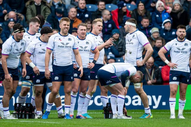 Scotland's players look dejected after the defeat by France.