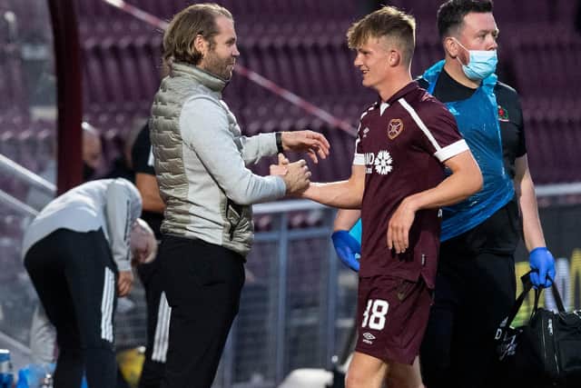 Finlay Pollock is congratulated by Hearts manager Robbie Neilson on Tuesday.