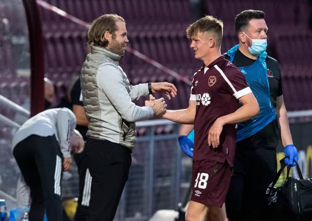 Finlay Pollock is congratulated by Hearts manager Robbie Neilson on Tuesday.