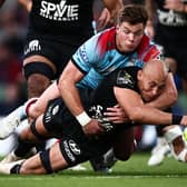 Huw Jones is unable to prevent Toulon's Italian No 8 Sergio Parisse scoring the French club's second try in the 43-19 Challenge Cup final win. (Photo by Anne-Christine Poujoulat/AFP via Getty Images)