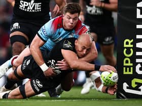 Huw Jones is unable to prevent Toulon's Italian No 8 Sergio Parisse scoring the French club's second try in the 43-19 Challenge Cup final win. (Photo by Anne-Christine Poujoulat/AFP via Getty Images)