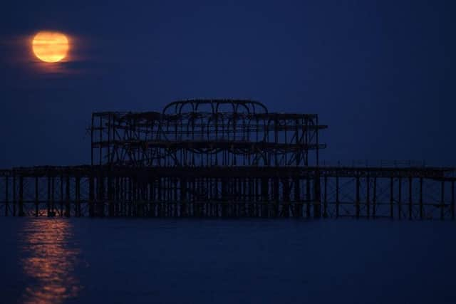 A supermoon rising over the West Pier on May 07, 2020 in Brighton.