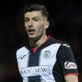 Mihai Popescu is waiting to fly to Edinburgh to join Hearts.