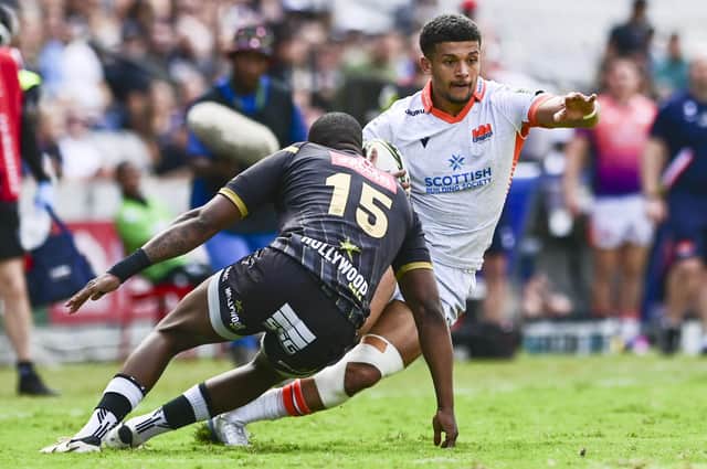 Edinburgh's Jake Henry on the attack against Sharks full-back Aphelele Fassi during the EPCR Challenge Cup quarter-final at Kings Park, Durban. (Photo: Steve Haag Sports/INPHO/Shutterstock)