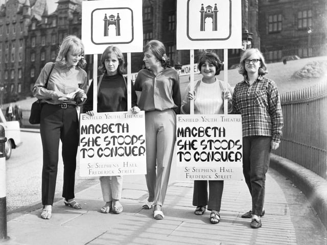 Girls from Enfield Youth Theatre wear sandwich boards to promote their productions of Macbeth & She Stoops to Conquer during the Edinburgh Festival in 1966.