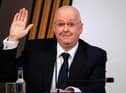 The SNP's chief executive will face a vote of no confidence unless he announces a plan to resign today, a senior member of the party’s ruling governing body has claimed.