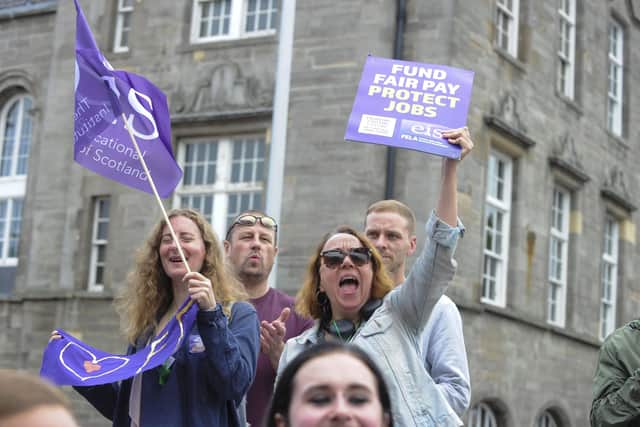 Striking college lecturers protest outside the Scottish Parliament. Image: Lisa Ferguson
