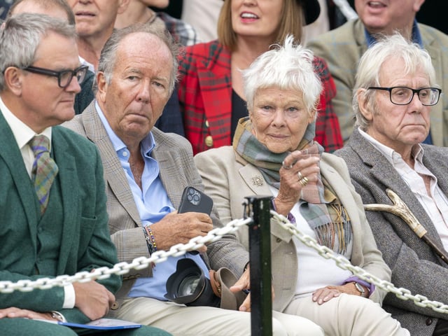 Dame Judi Dench and David Mills (right) watching the Braemar Royal Highland Gathering at the Princess Royal and Duke of Fife Memorial Park in Braemar.