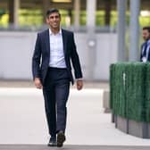 Suits you, Rishi. Sunak looks dapper but can he relate to the man in the street who can't afford £3,500 worth of Savile Row threads? (Picture: Victoria Jones/PA)