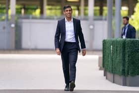 Suits you, Rishi. Sunak looks dapper but can he relate to the man in the street who can't afford £3,500 worth of Savile Row threads? (Picture: Victoria Jones/PA)