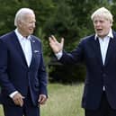 US president Joe Biden and Britain's Prime Minister Boris Johnson, right, chat as they gather for a group photo at Castle Elmau in Kruen, near Garmisch-Partenkirchen, Germany, on Sunday. Picture: Brendan Smialowski/Pool via AP