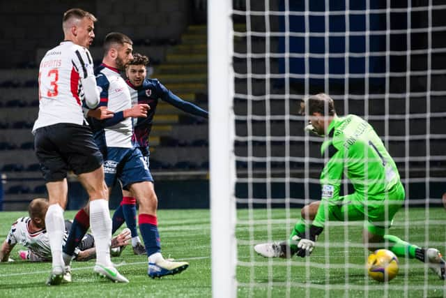 Dario Zanatta slides the ball under Owain Fon Williams to put Raith ahead against Dunfermline.