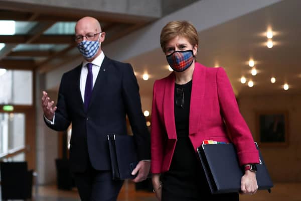 First Minister Nicola Sturgeon and Deputy First Minister John Swinney arrive for First Minister's Questions.